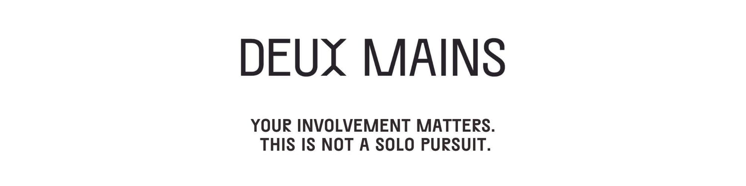 The logo for Deux Mains.