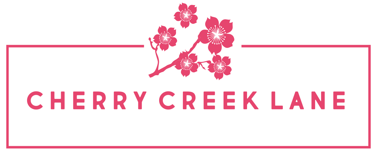 The logo for cherrycreeklane.